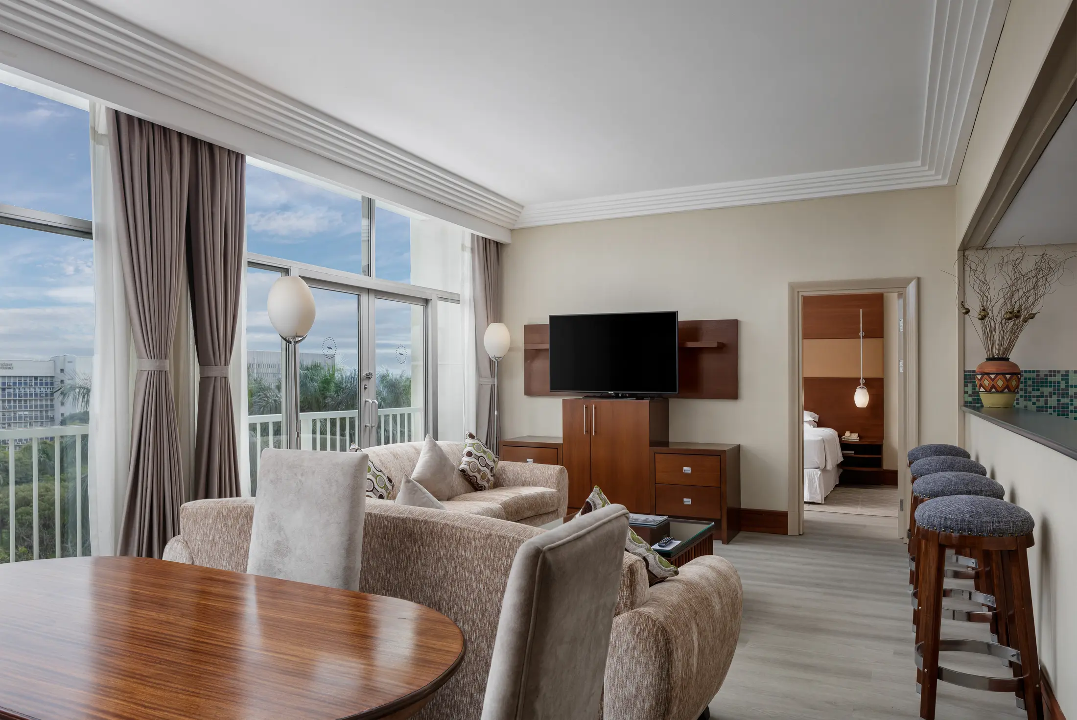 Spacious hotel suite with living and dining areas